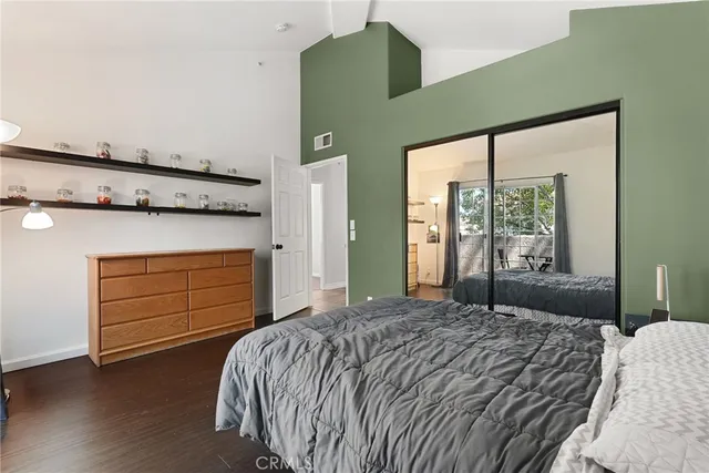 a bedroom with a bed and a dresser