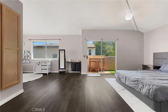 a bedroom with a bed and a view of bedroom