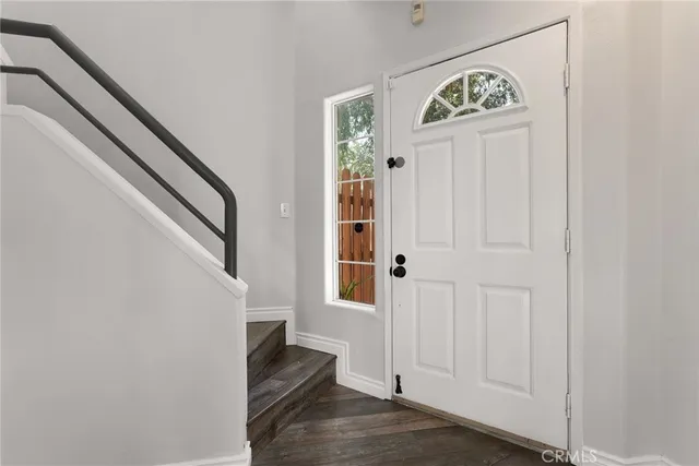 a view of an entryway with wooden floor