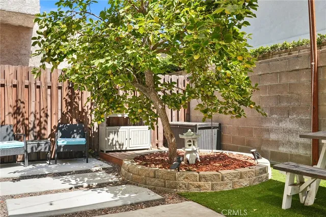 a wooden bench sitting in front of a building