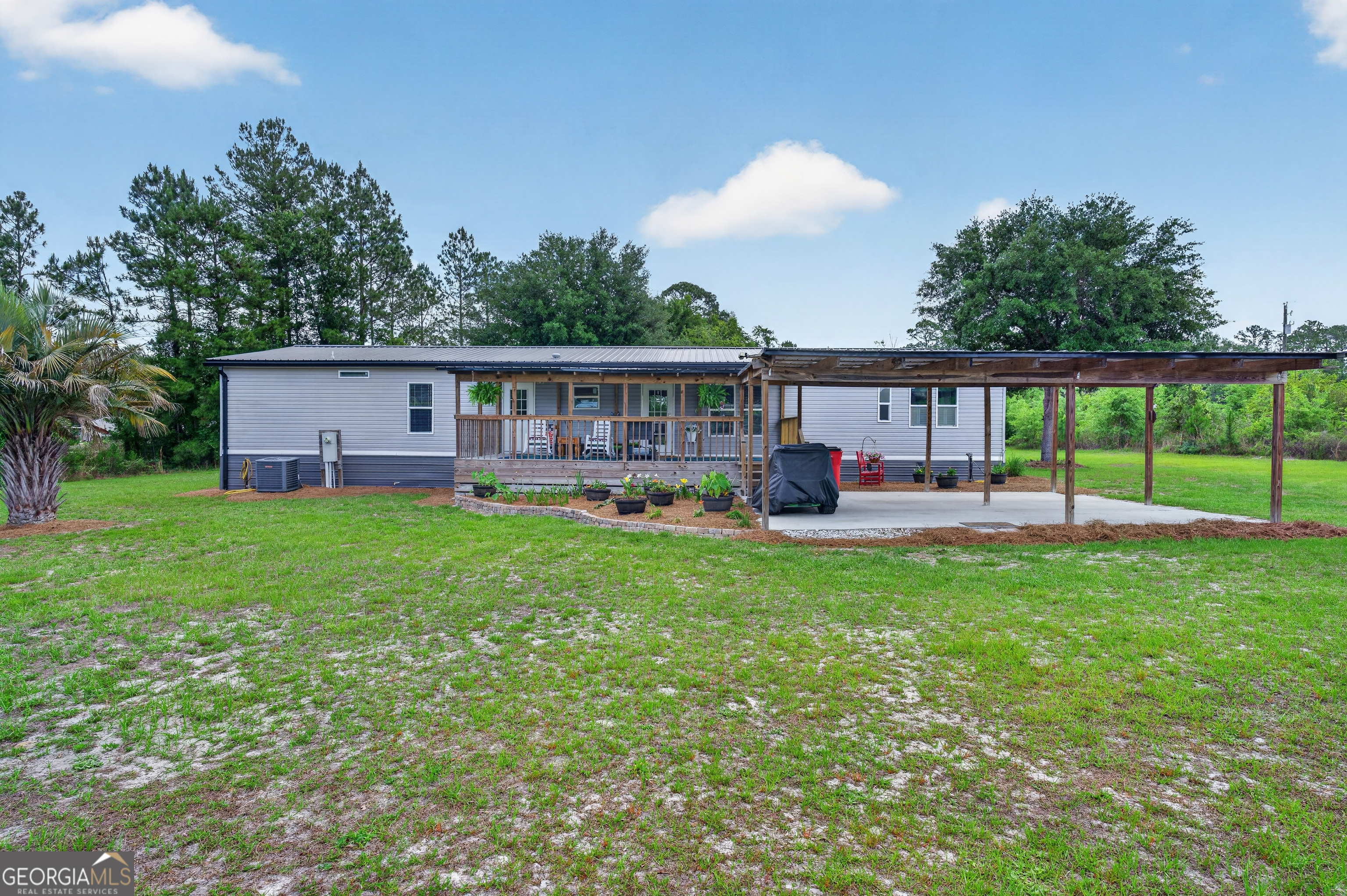 1953 Raybon Road West Hoboken, GA 31542 - Photo 24 of 31 a house view with swimming pool and garden space