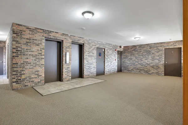 a view of an empty room with a fireplace