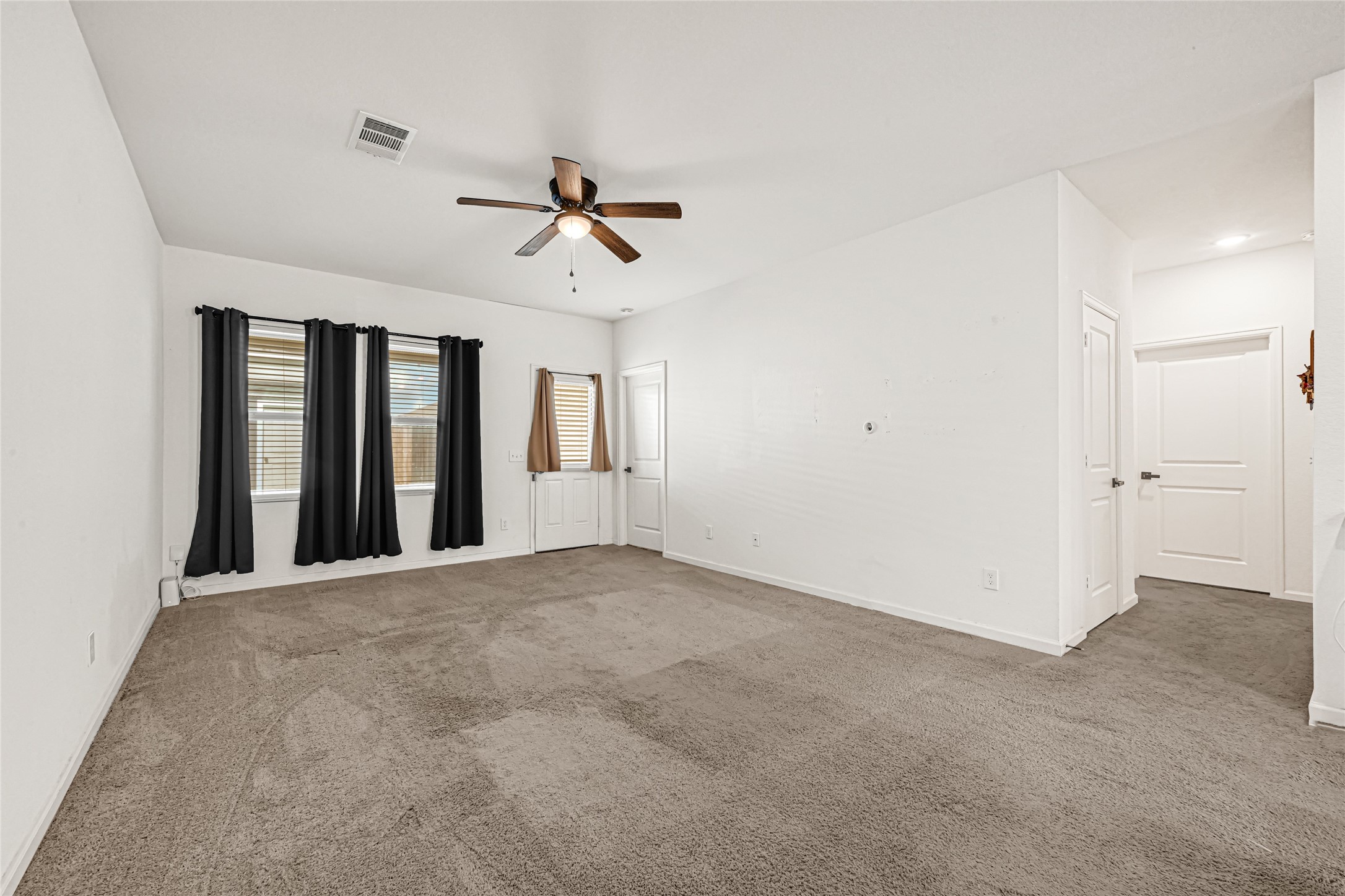 7311 Roseshine Drive Houston, TX 77049 - Photo 9 of 26 Additional view of the comfortable living space with vinyl flooring and natural light.