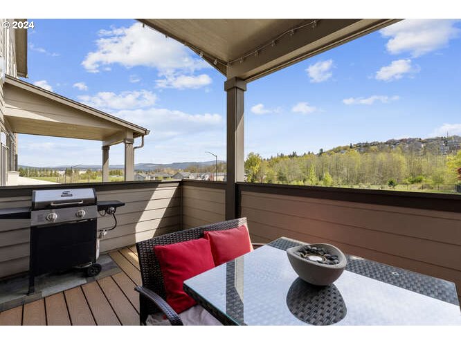 4307 Northwest Sage Loop Camas, WA 98607 - Photo 12 of 40 a view of roof deck with dining table and chairs