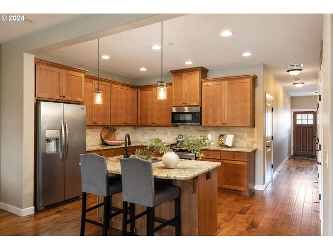 4307 Northwest Sage Loop Camas, WA 98607 - Photo 15 of 40 a kitchen with a refrigerator and a sink