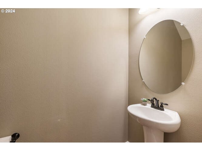 4307 Northwest Sage Loop Camas, WA 98607 - Photo 20 of 40 a bathroom with a sink and a mirror