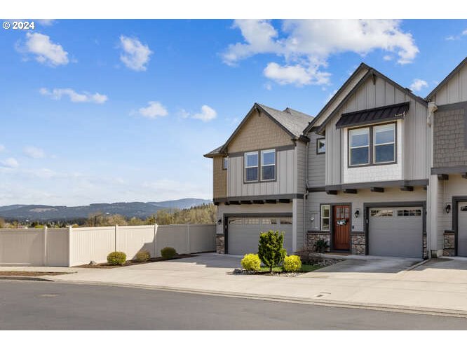 4307 Northwest Sage Loop Camas, WA 98607 - Photo 2 of 40 a view of a house with a yard and sitting area