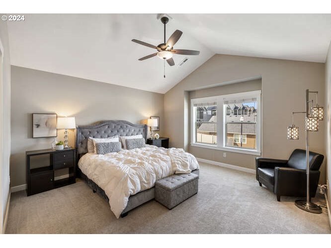 4307 Northwest Sage Loop Camas, WA 98607 - Photo 22 of 40 a bedroom with a bed and a chandelier