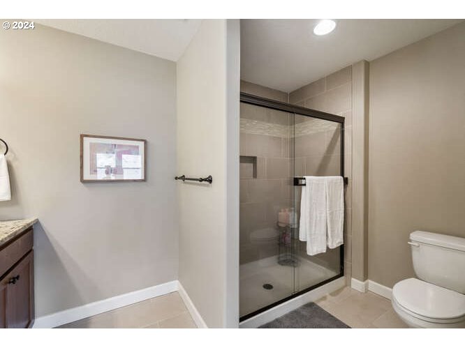 4307 Northwest Sage Loop Camas, WA 98607 - Photo 27 of 40 a bathroom with a shower and toilet