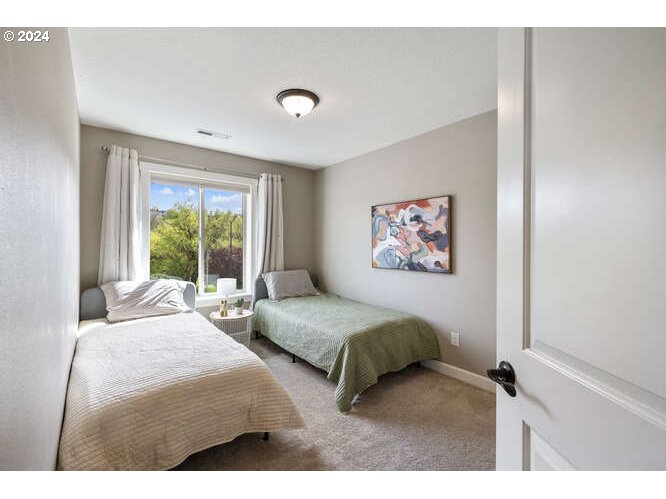 4307 Northwest Sage Loop Camas, WA 98607 - Photo 30 of 40 a bedroom with a large bed and a window
