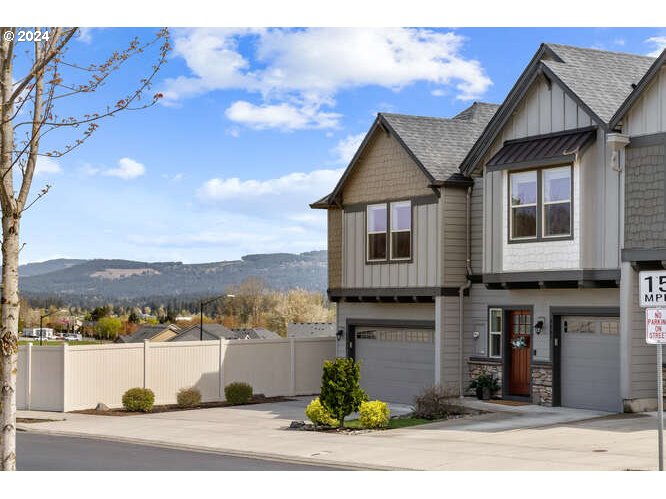4307 Northwest Sage Loop Camas, WA 98607 - Photo 35 of 40 a front view of a house with a yard