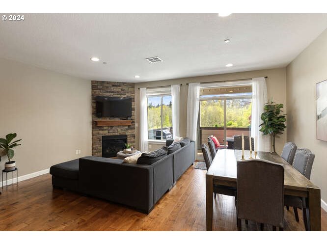 4307 Northwest Sage Loop Camas, WA 98607 - Photo 7 of 40 a living room with fireplace furniture and a large window