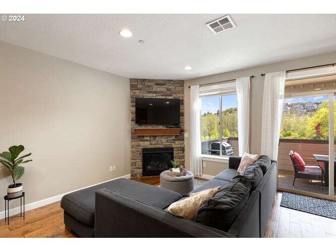 4307 Northwest Sage Loop Camas, WA 98607 - Photo 8 of 40 a living room with furniture and a fireplace