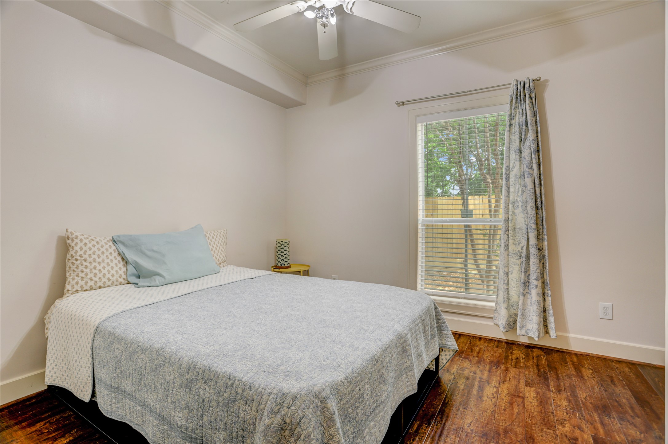 4262 Childress Street, Unit B Houston, TX 77005 - Photo 5 of 22 a bed sitting in a bedroom next to a window