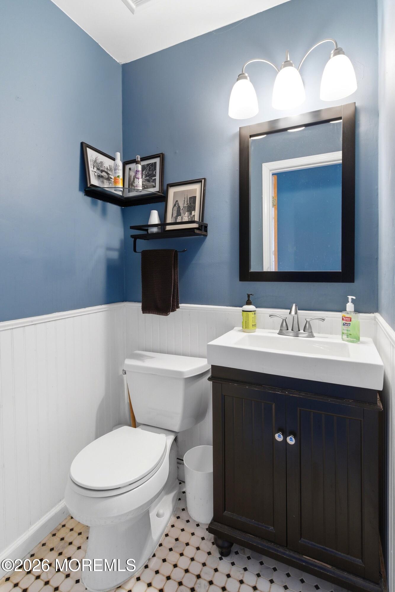 822 York Road Brick, NJ 08724 - Photo 16 of 37 a bathroom with a toilet sink and mirror