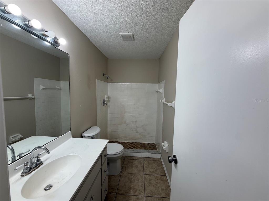855 Jamaica Road Venice, FL 34293 - Photo 17 of 19 a bathroom with a sink toilet and shower