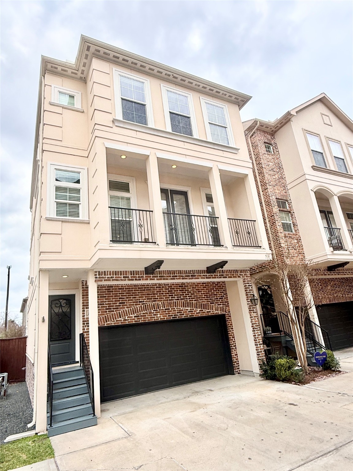 2116 Couch Street Houston, TX 77008 - Photo 1 of 43 a building with a window and balcony