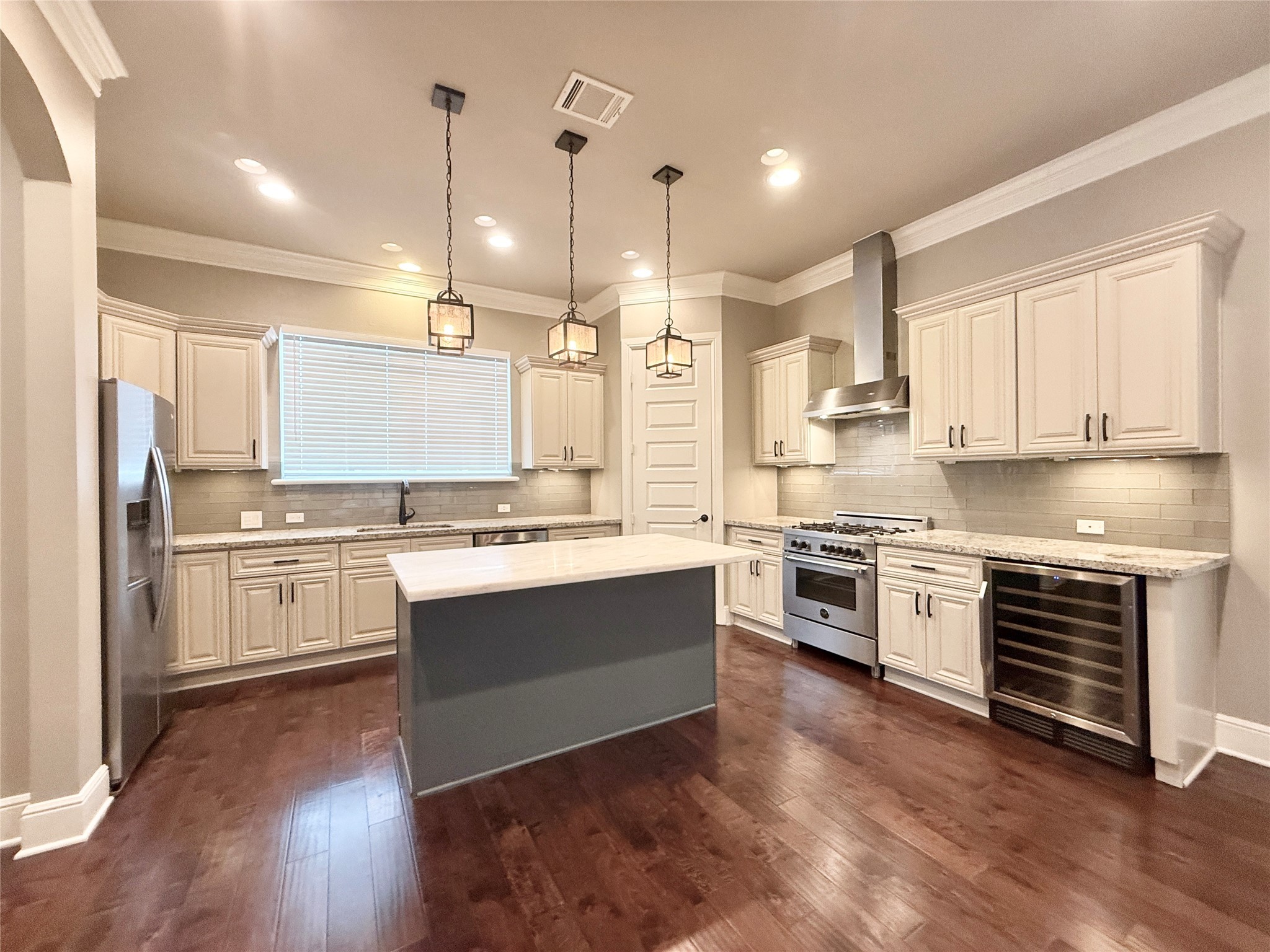 2116 Couch Street Houston, TX 77008 - Photo 13 of 43 a large kitchen with cabinets and stainless steel appliances