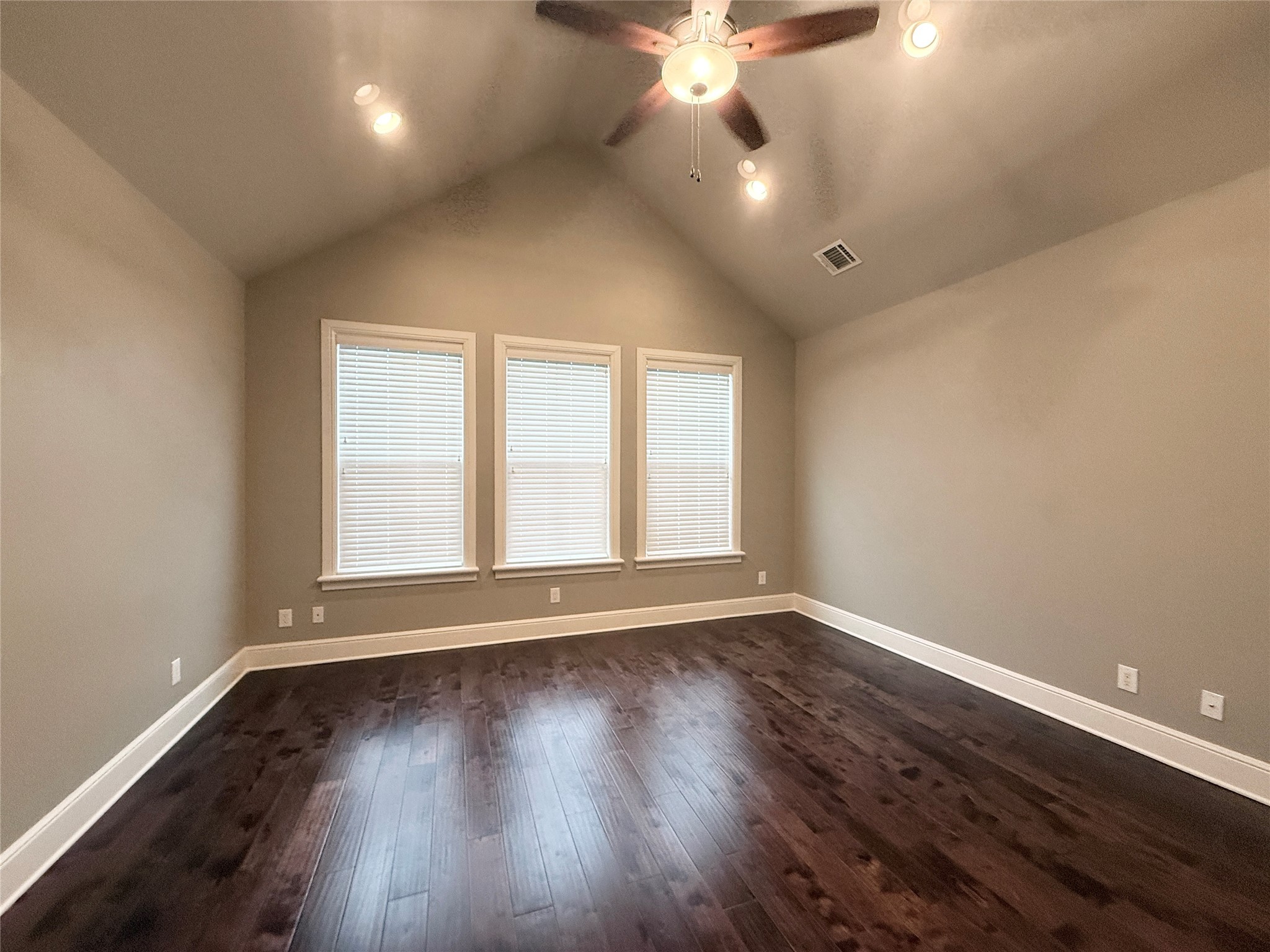 2116 Couch Street Houston, TX 77008 - Photo 20 of 43 an empty room with wooden floor and windows