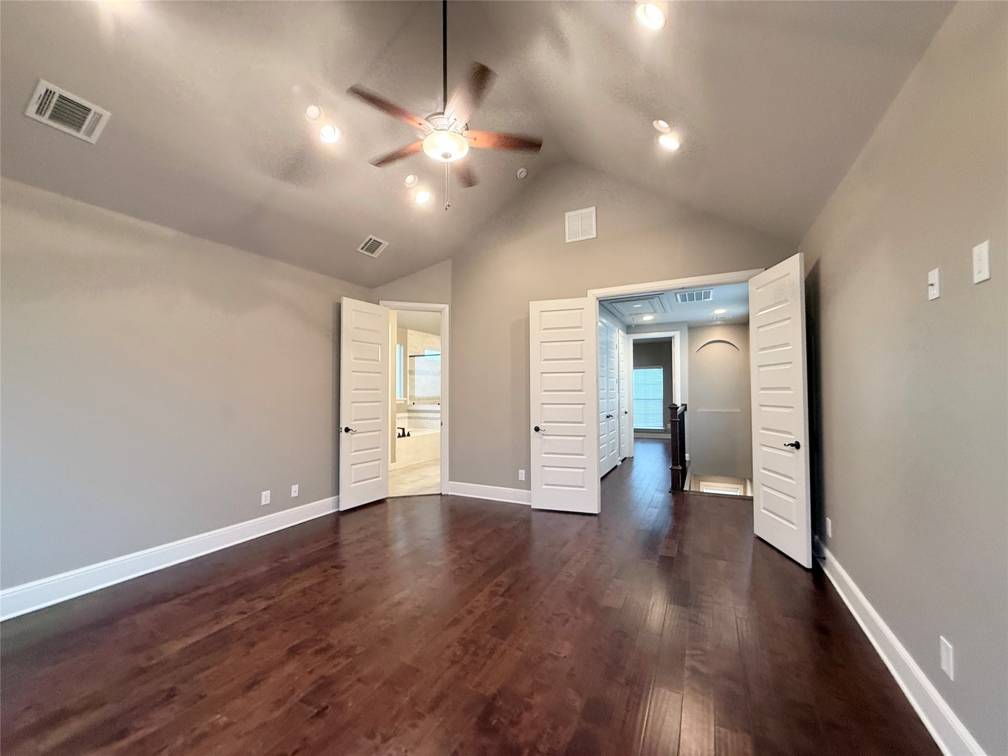 2116 Couch Street Houston, TX 77008 - Photo 21 of 43 a view of an empty room with wooden floor