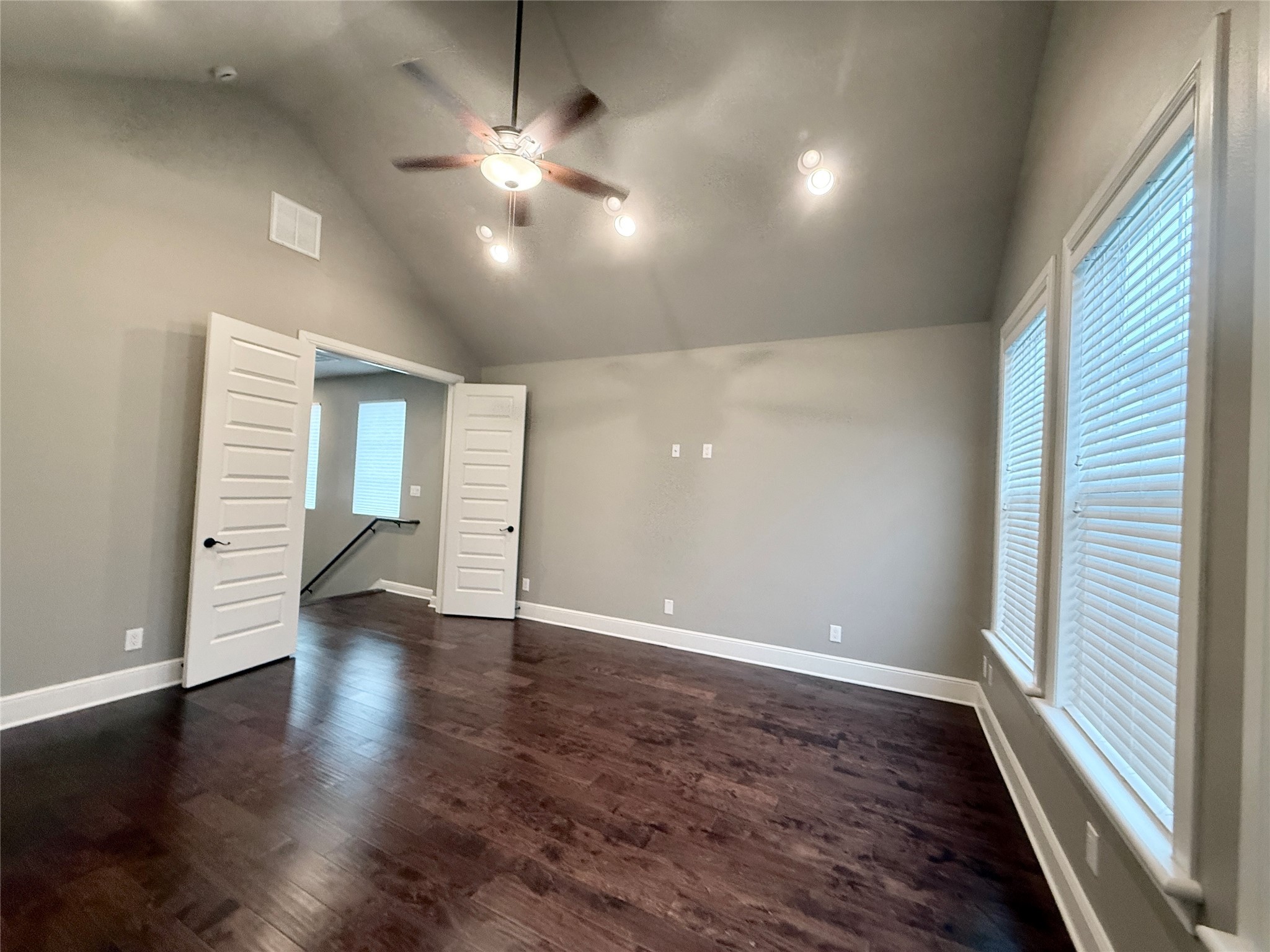 2116 Couch Street Houston, TX 77008 - Photo 22 of 43 an empty room with wooden floor and windows