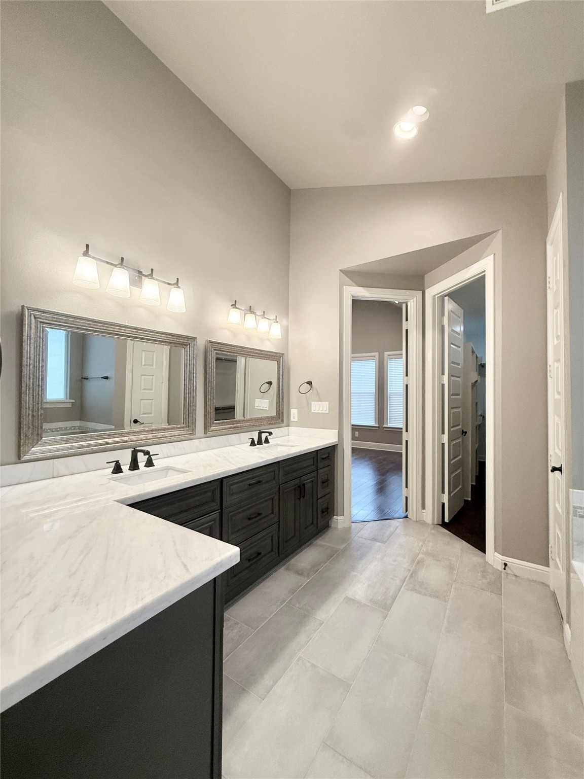2116 Couch Street Houston, TX 77008 - Photo 25 of 43 a large bathroom with a sink and a large mirror