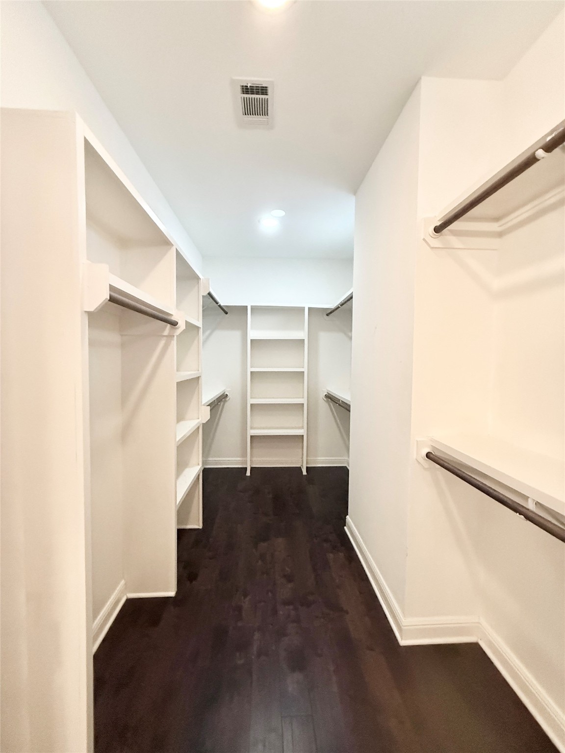 2116 Couch Street Houston, TX 77008 - Photo 28 of 43 a view of an empty walk in closet