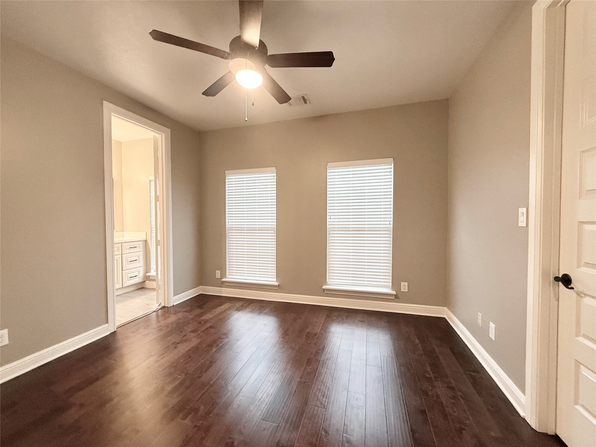 2116 Couch Street Houston, TX 77008 - Photo 29 of 43 a view of an empty room with wooden floor and a window