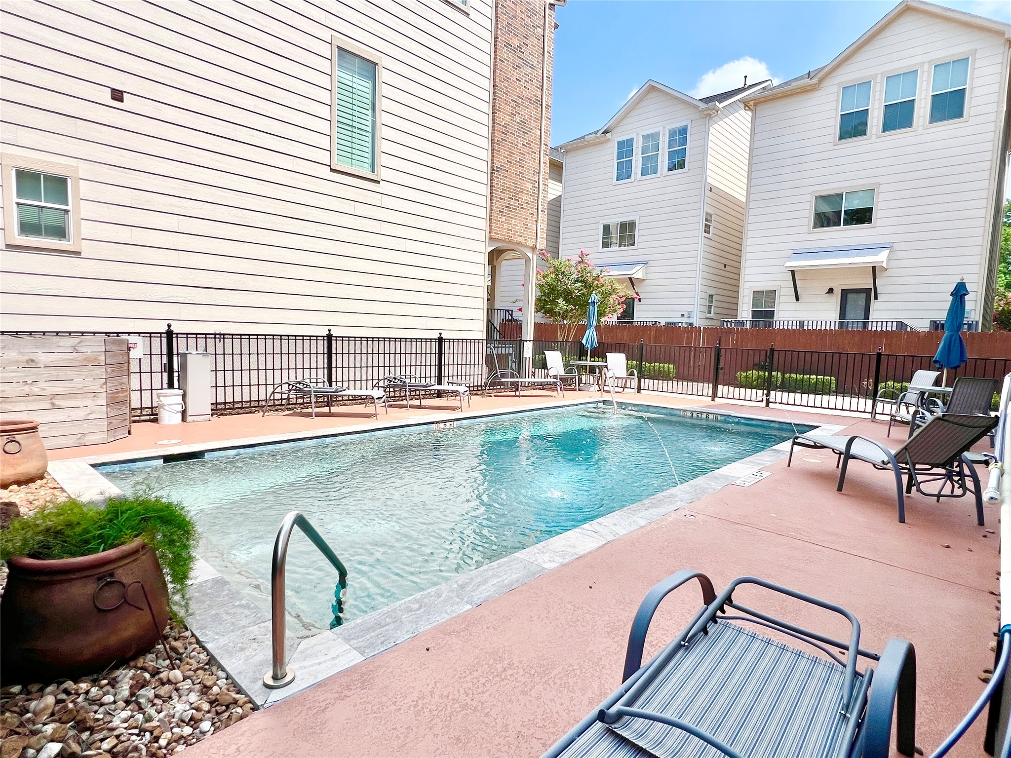 2116 Couch Street Houston, TX 77008 - Photo 3 of 43 a view of a patio with chairs and potted plants