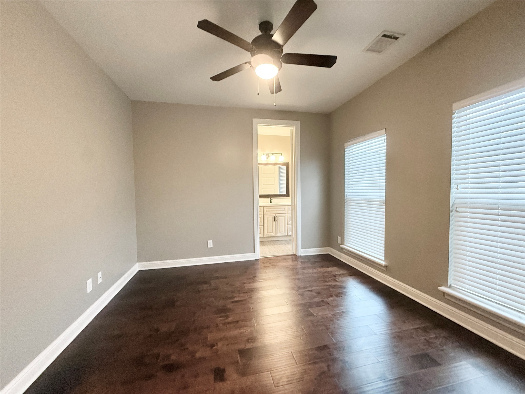 2116 Couch Street Houston, TX 77008 - Photo 31 of 43 an empty room with wooden floor and windows