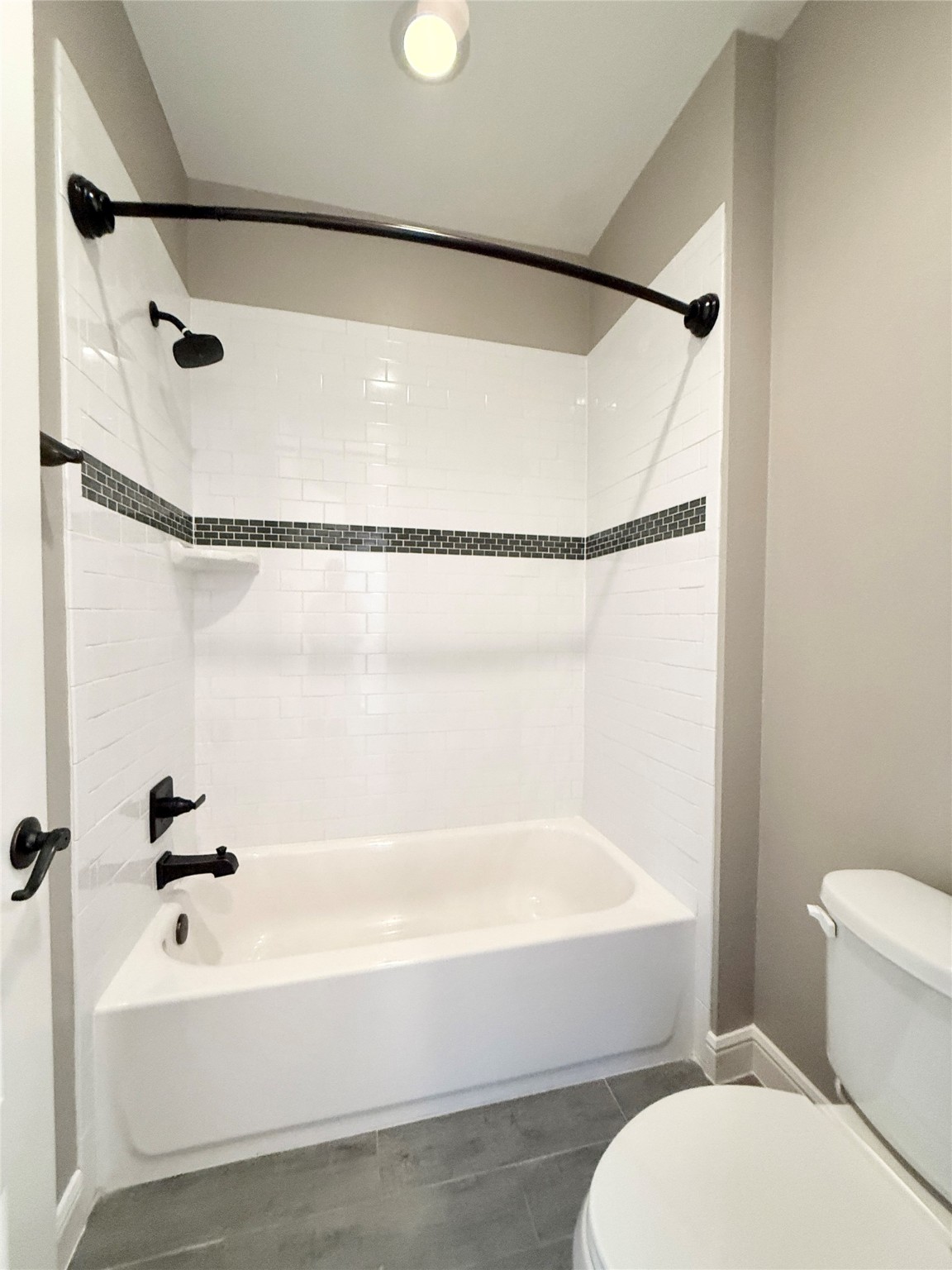 2116 Couch Street Houston, TX 77008 - Photo 33 of 43 a bathroom with a bathtub and a shower