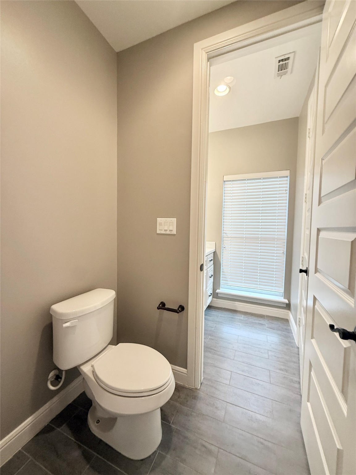 2116 Couch Street Houston, TX 77008 - Photo 34 of 43 a white toilet sitting next to a bathroom sink