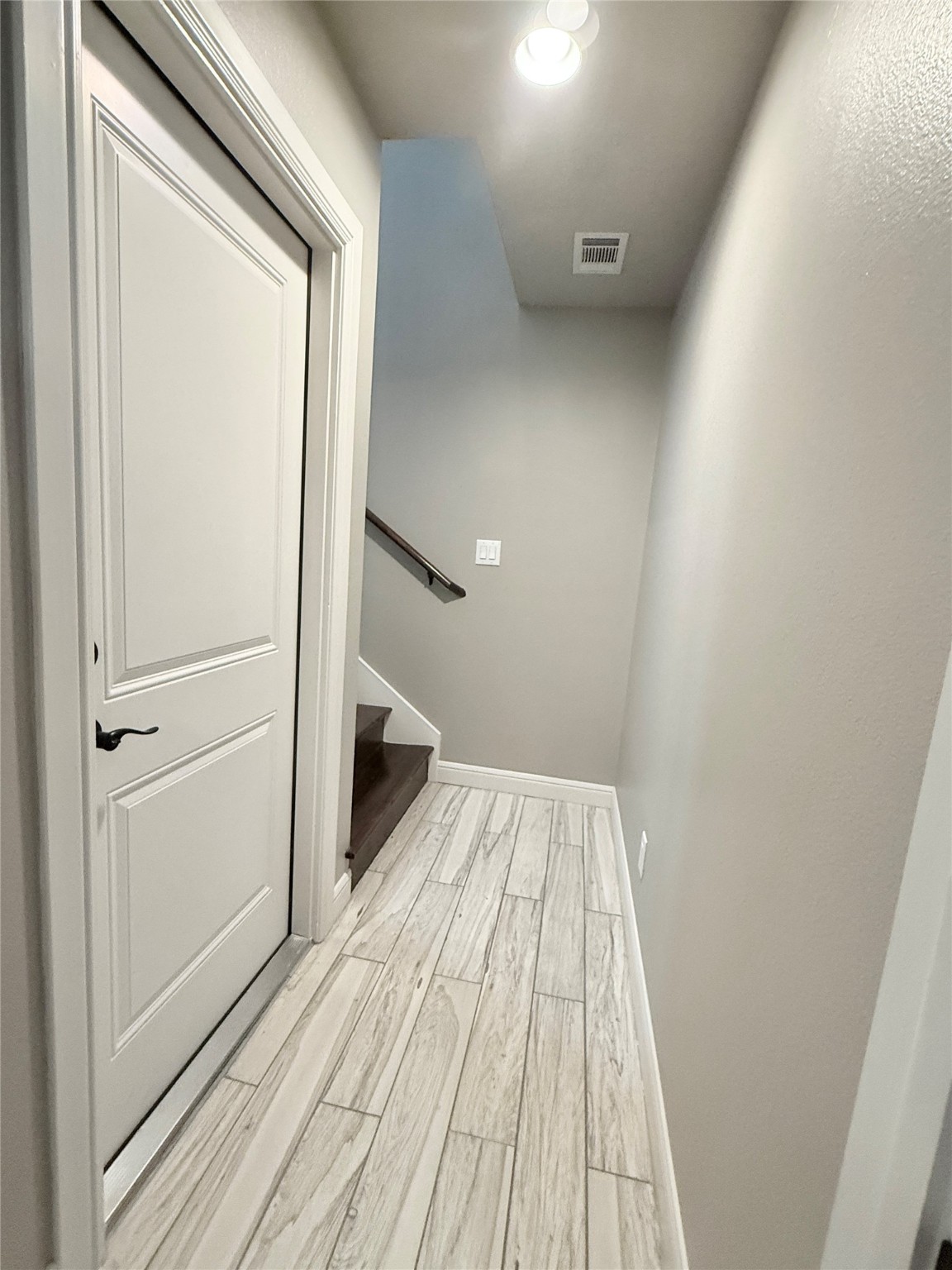 2116 Couch Street Houston, TX 77008 - Photo 38 of 43 a view of a hallway with wooden floor and staircase