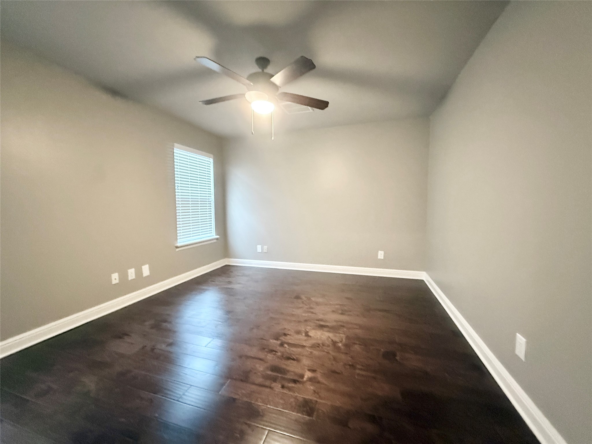 2116 Couch Street Houston, TX 77008 - Photo 39 of 43 an empty room with wooden floor and windows