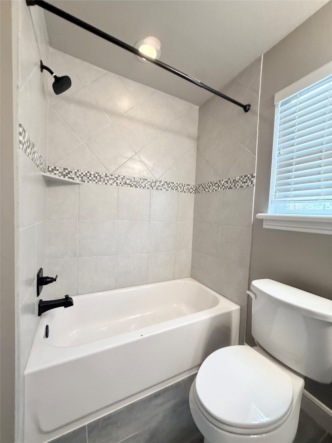 2116 Couch Street Houston, TX 77008 - Photo 43 of 43 a white bath tub sitting next to a white toilet