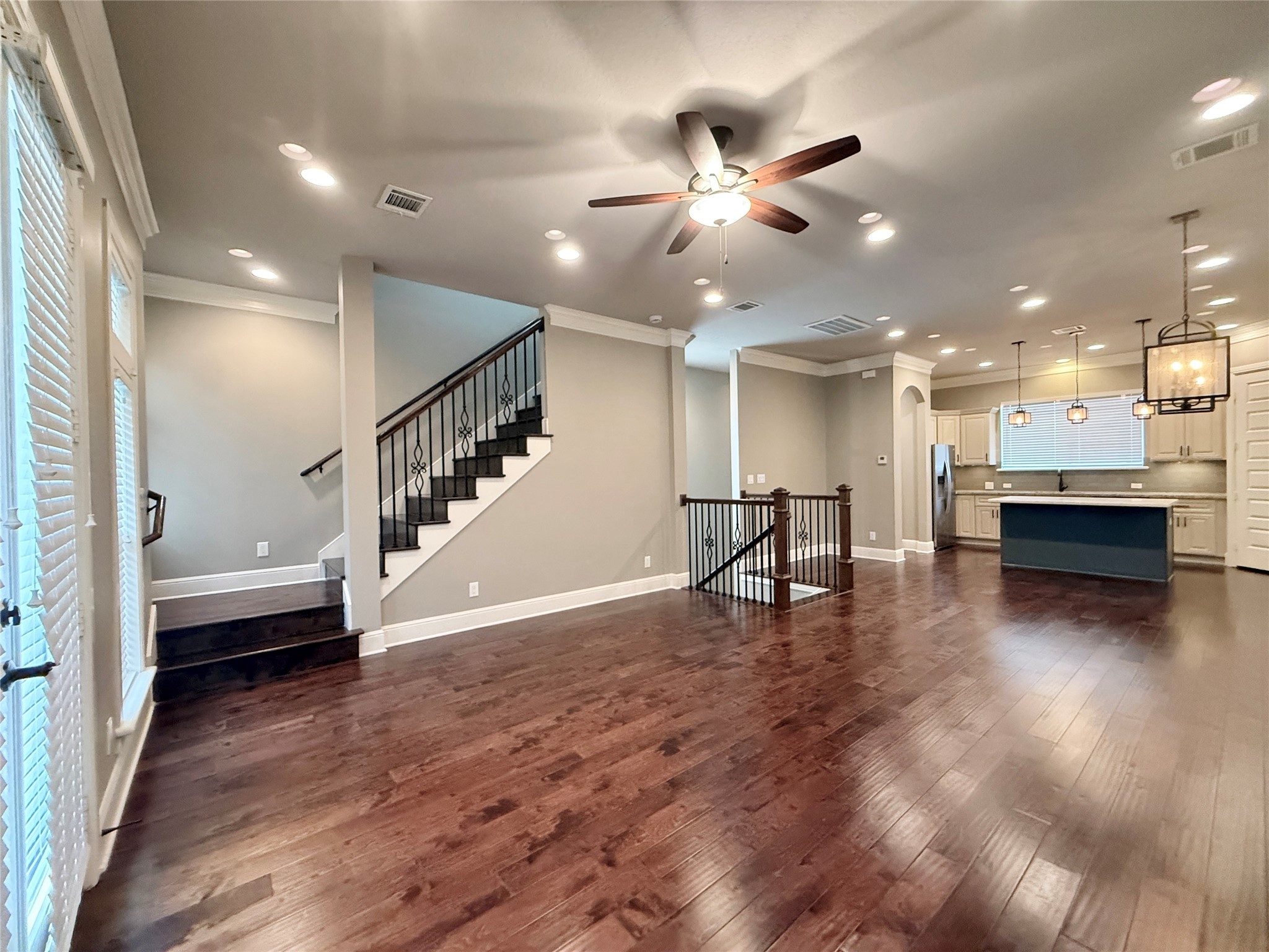 2116 Couch Street Houston, TX 77008 - Photo 8 of 43 a view of a livingroom with a ceiling fan and kitchen floor