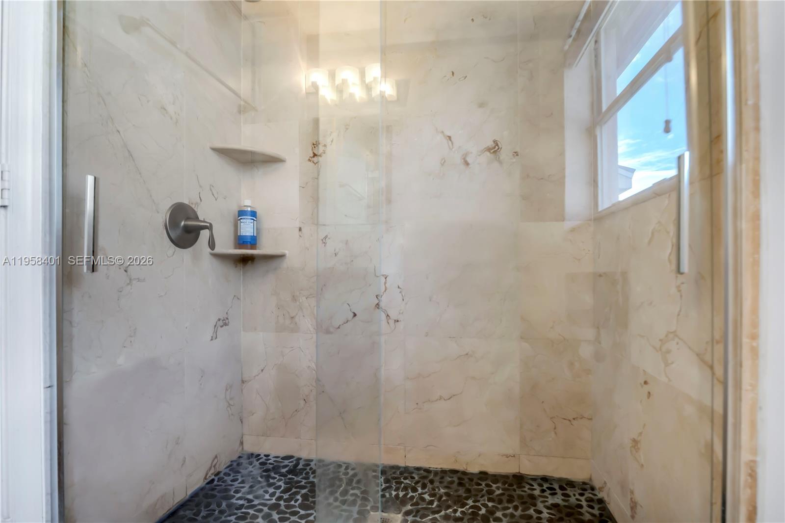 17476 Southwest 20th Street Miramar, FL 33029 - Photo 12 of 28 a bathroom with a shower