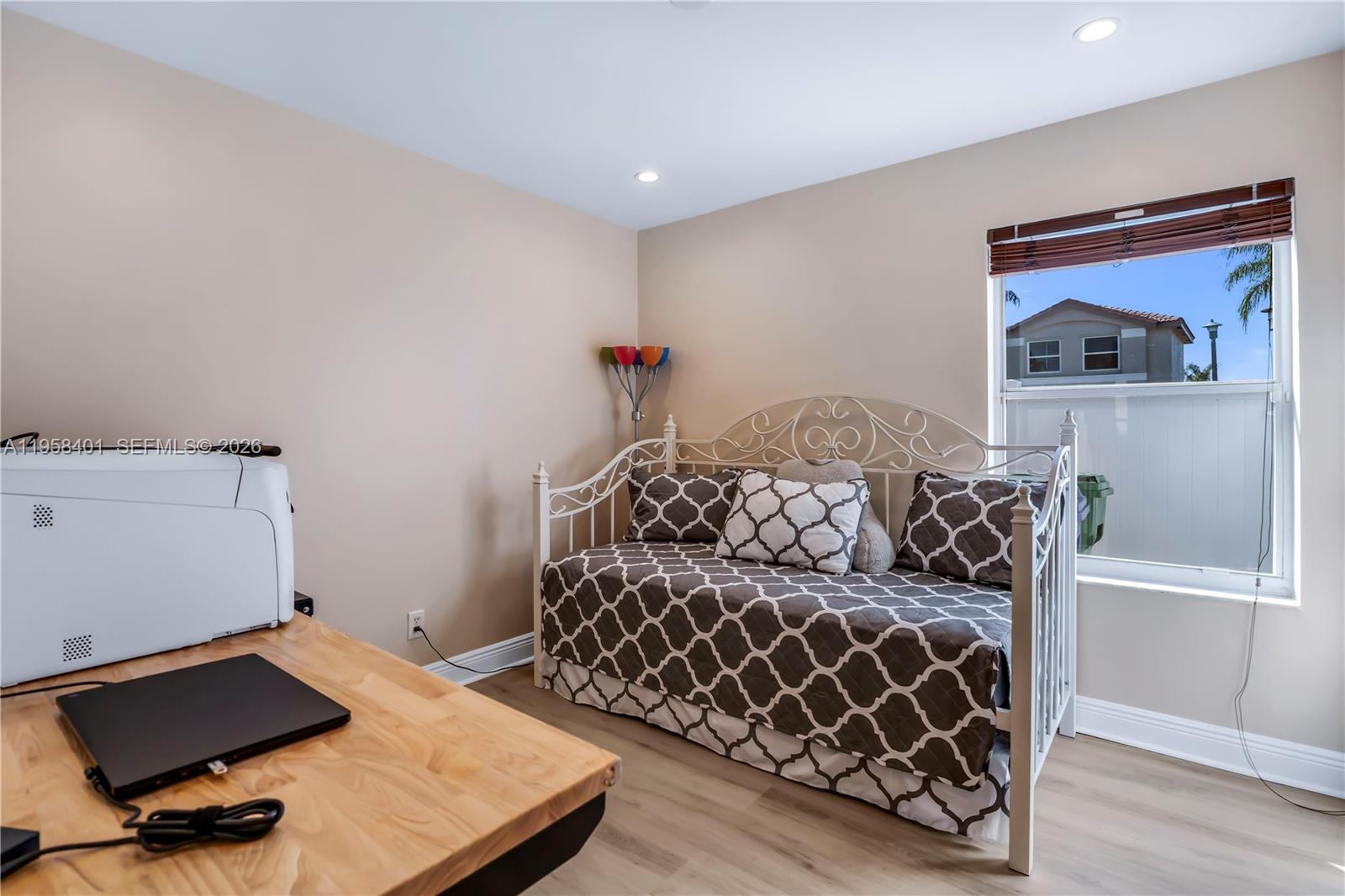 17476 Southwest 20th Street Miramar, FL 33029 - Photo 14 of 28 a bedroom with furniture and a window