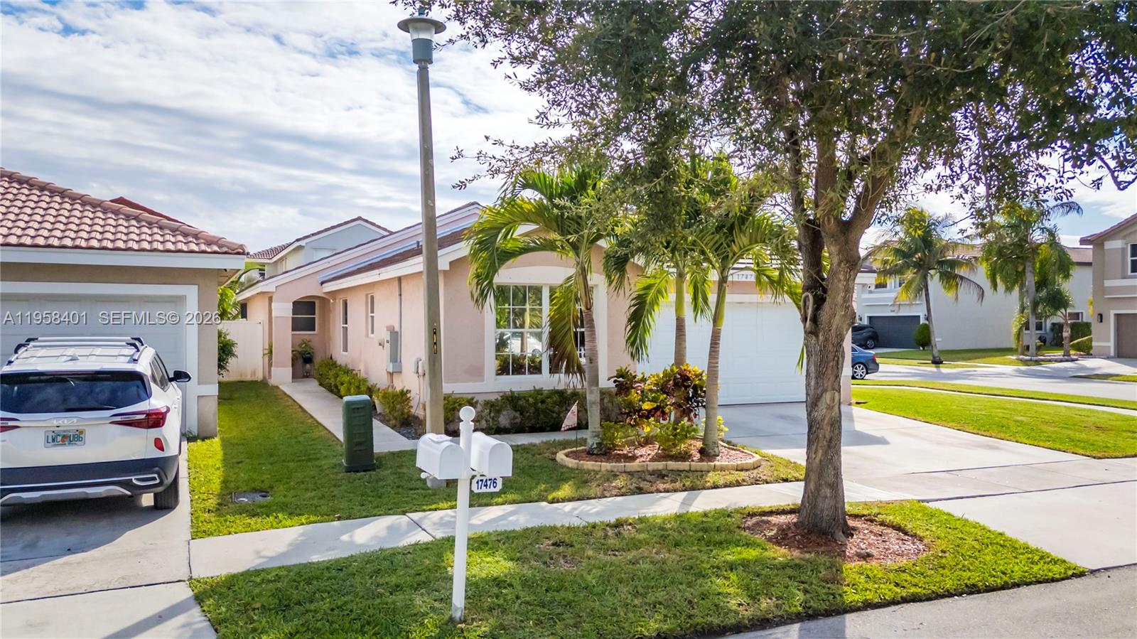 17476 Southwest 20th Street Miramar, FL 33029 - Photo 23 of 28 a front view of a house with garden