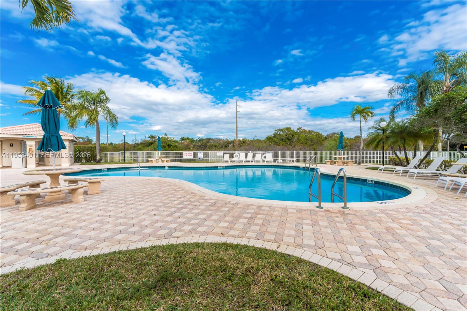 17476 Southwest 20th Street Miramar, FL 33029 - Photo 26 of 28 a view of a swimming pool and an outdoor space