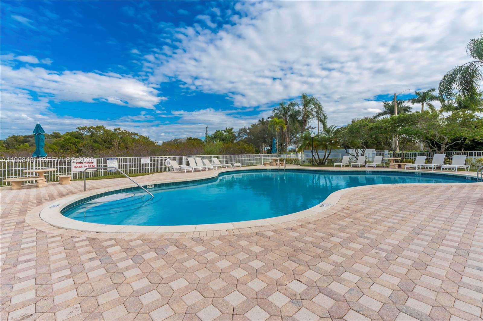 17476 Southwest 20th Street Miramar, FL 33029 - Photo 27 of 28 a view of a swimming pool and a yard