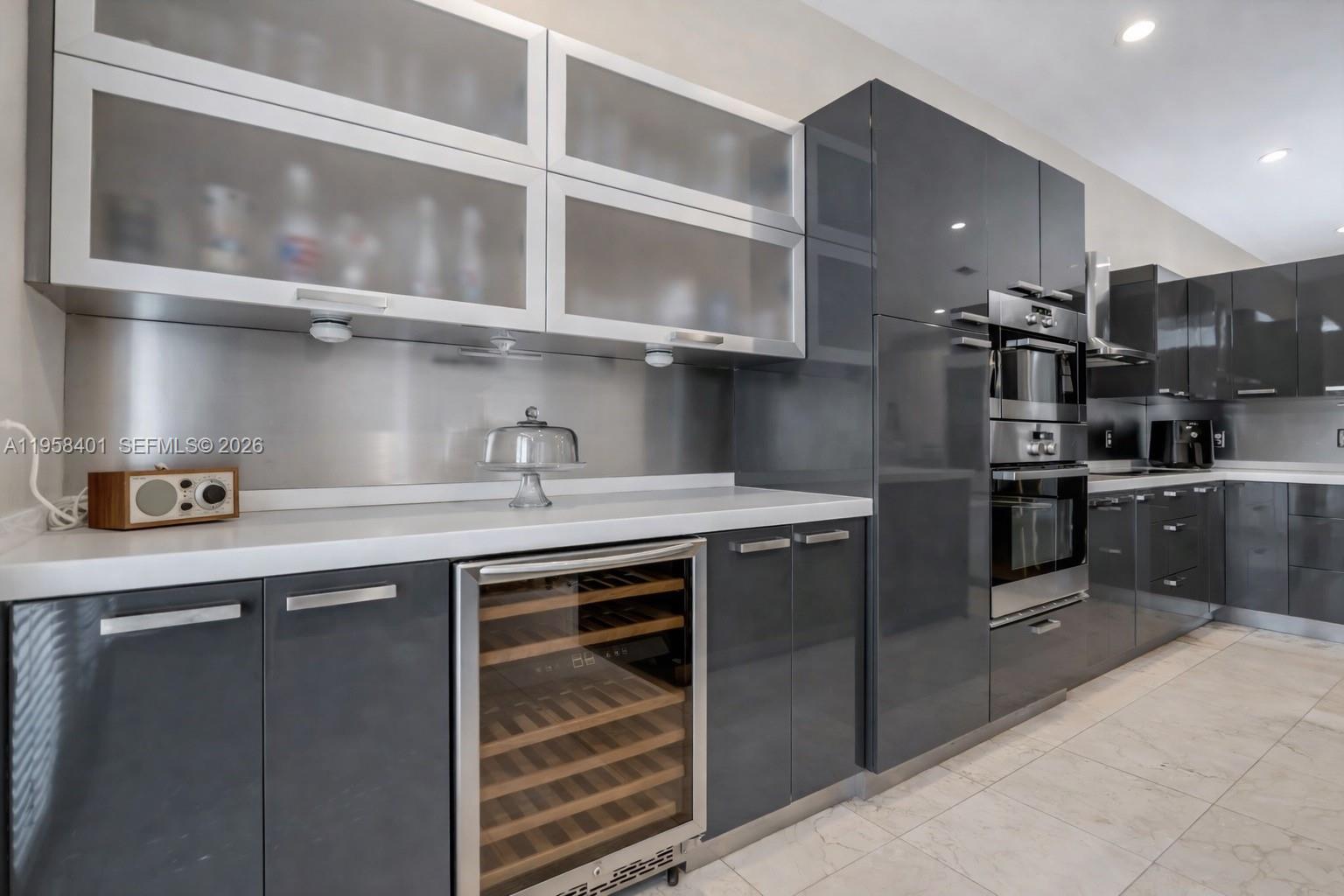 17476 Southwest 20th Street Miramar, FL 33029 - Photo 6 of 28 a kitchen with stainless steel appliances granite countertop a sink a stove and cabinets