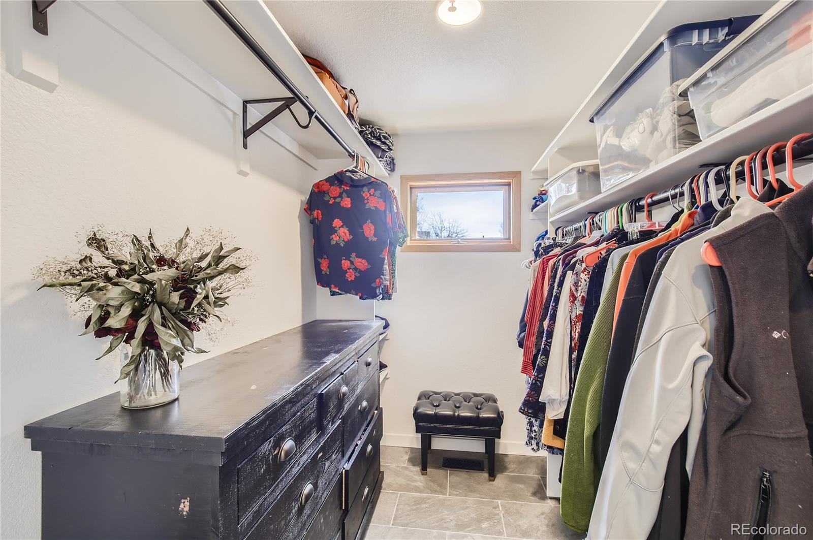 7578 Crestview Drive Niwot, CO 80504 - Photo 19 of 40 a view of walk in closet with clothes