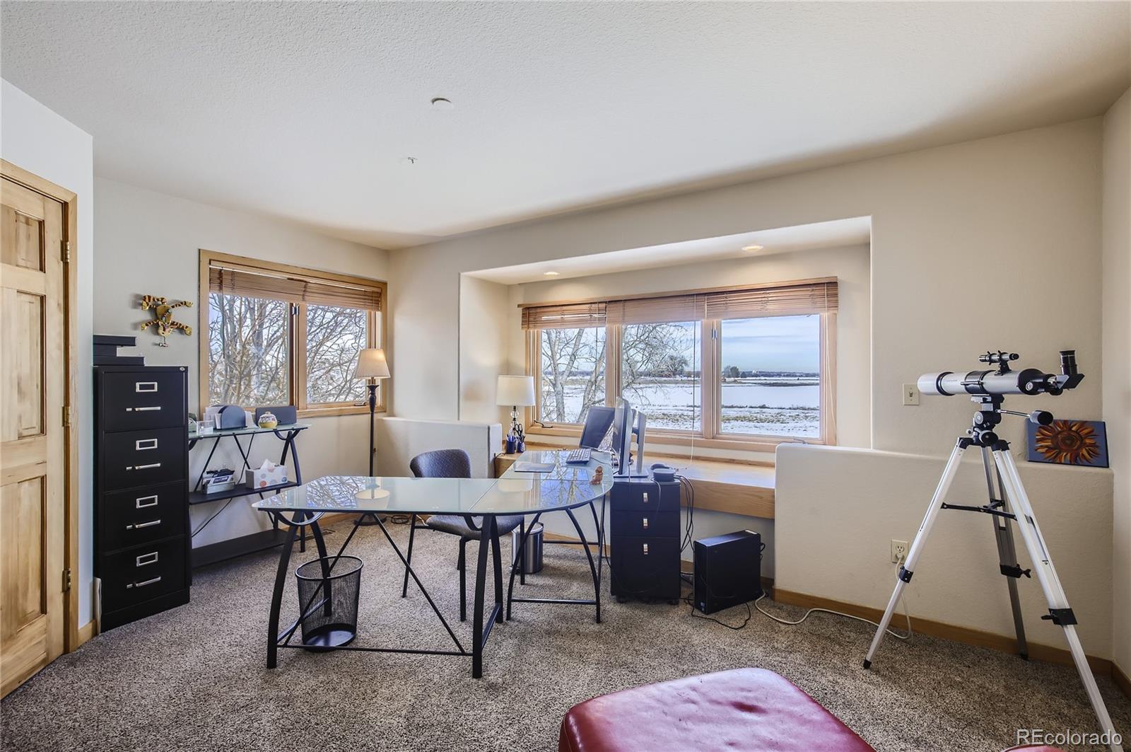 7578 Crestview Drive Niwot, CO 80504 - Photo 23 of 40 a view of a workspace with furniture and window