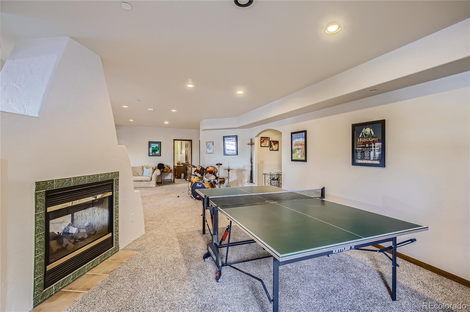 7578 Crestview Drive Niwot, CO 80504 - Photo 26 of 40 a living room with furniture pool table and a fireplace
