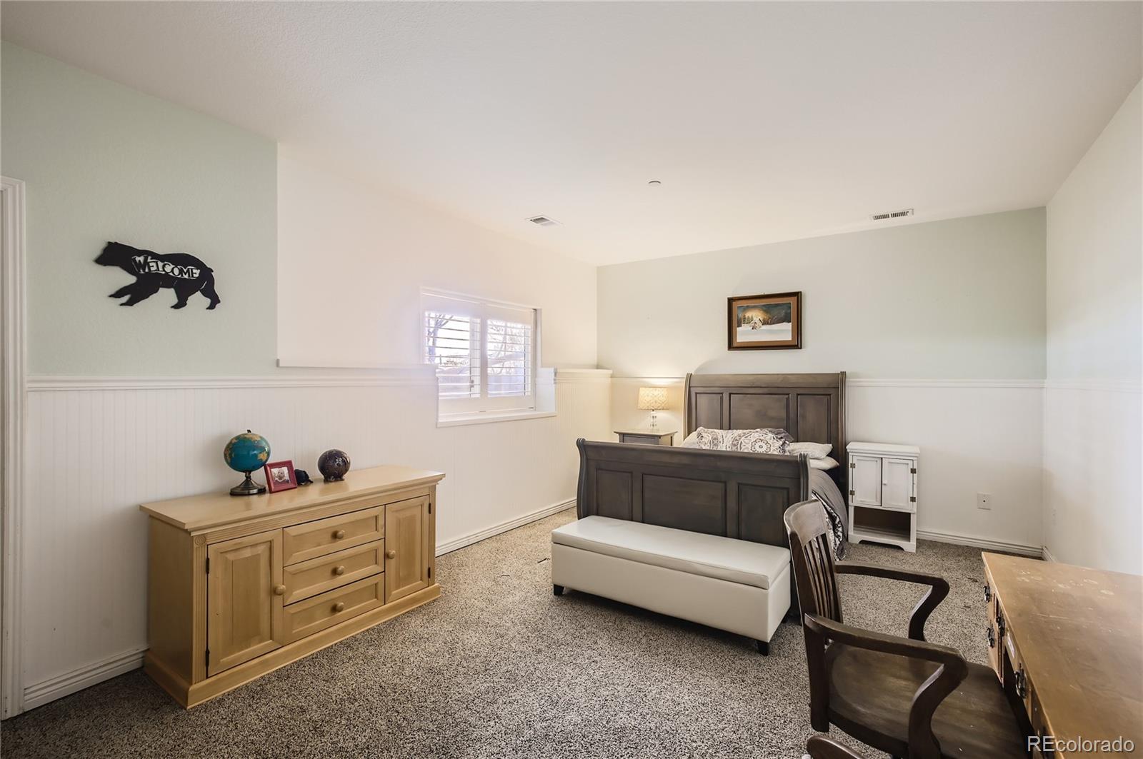 7578 Crestview Drive Niwot, CO 80504 - Photo 28 of 40 a bed room with furniture and a window