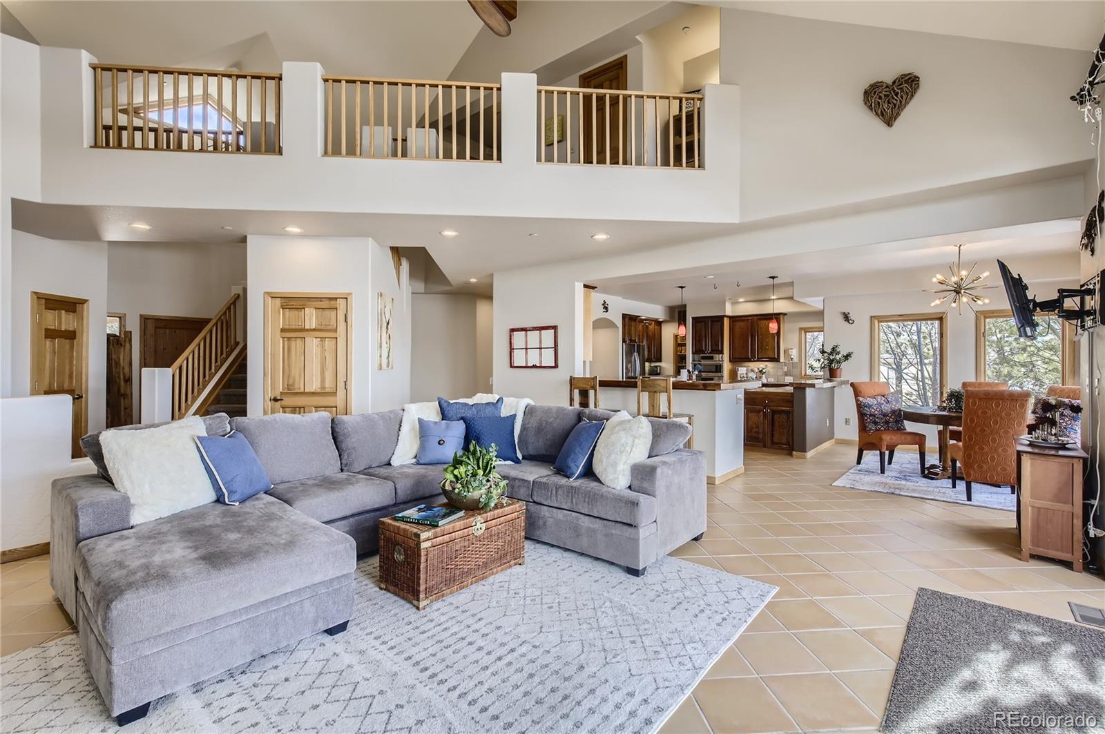 7578 Crestview Drive Niwot, CO 80504 - Photo 3 of 40 a living room with furniture kitchen view and a large window