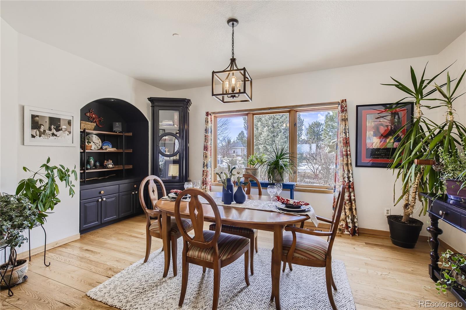 7578 Crestview Drive Niwot, CO 80504 - Photo 9 of 40 a view of a dining room with furniture window and wooden floor