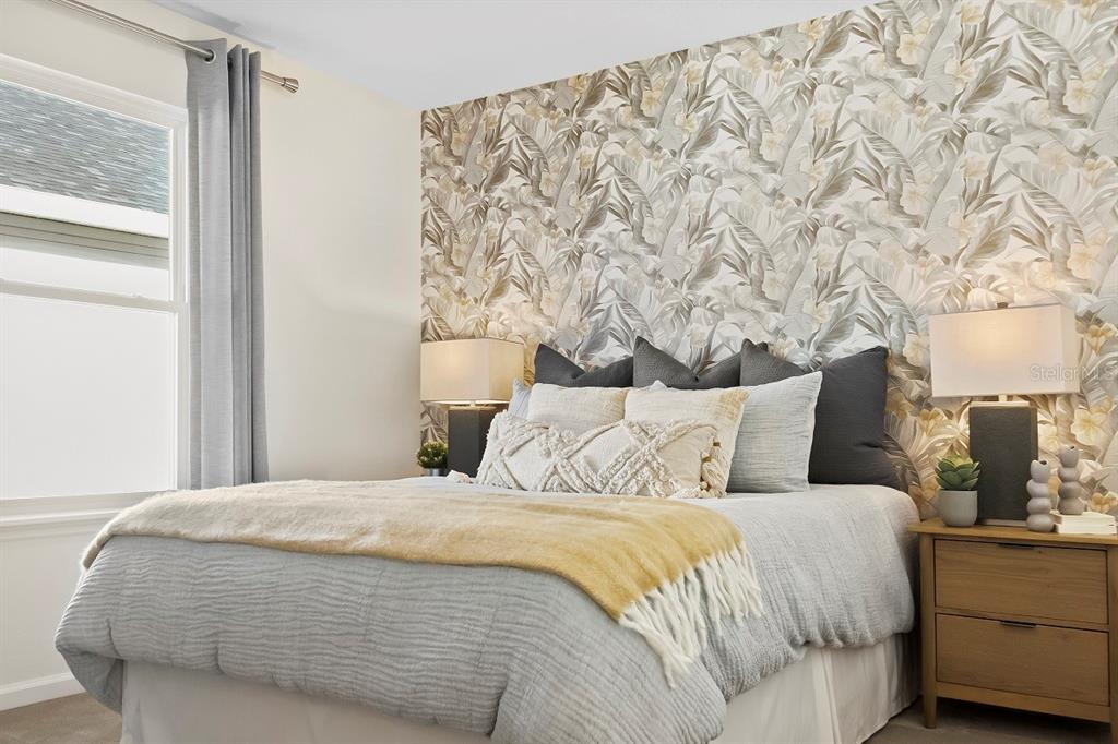 4 Gilded Court Flagler Beach, FL 32136 - Photo 6 of 12 a large bed sitting in a bedroom next to a window