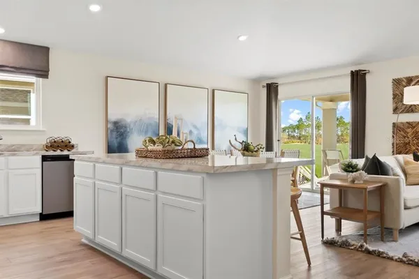 a kitchen with a refrigerator and a sink